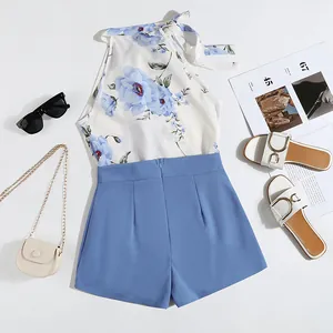 Stylish summer floral halter top and blue shorts set with trendy vacation accessories