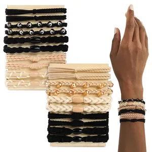 Bohemian braided hair ties and bracelets set in black and beige tones.
