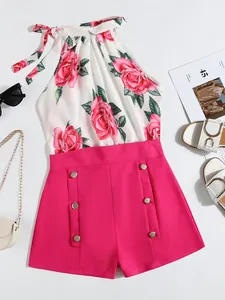 Chic summer 2-piece outfit featuring a rose floral halter top and vibrant pink buttoned shorts