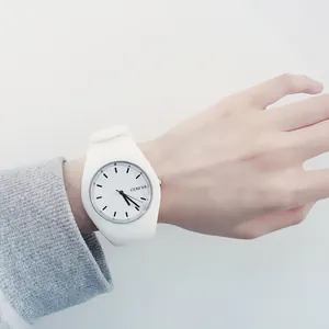 Minimalist white silicone Geneva quartz watch for women presented on a person's wrist