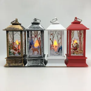 Set of four Christmas decorative LED lanterns with Santa and reindeer motifs.
