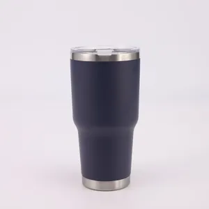A detailed close-up shot of a 30oz navy blue vacuum insulated stainless steel tumbler.