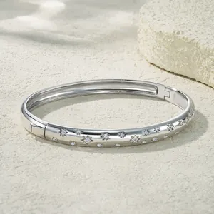Detailed view of sterling silver moissanite star engraved hinged bangle bracelet
