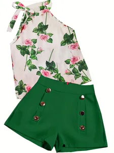 Two-piece summer set featuring a rose print halter top and green high-waisted shorts.