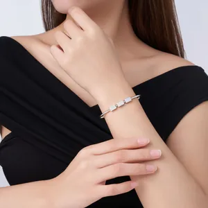 Elegant silver open bangle for women featuring three sparkling pave rectangular accents.