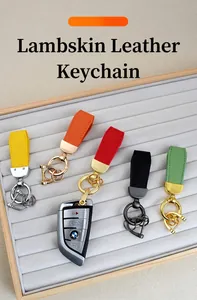 Detailed view of lambskin texture leather car keychains in multiple vibrant colors