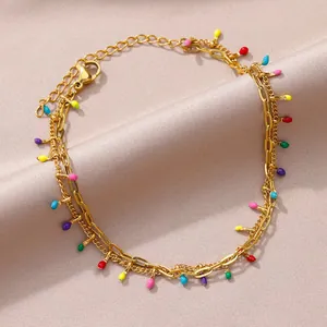 Detailed view of this bohemian stainless steel anklet with colorful enamel drop charms