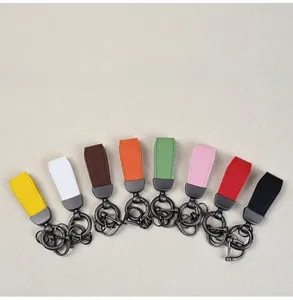 Variety of multi-color goat grain leather keychains with matte finish metal rings.
