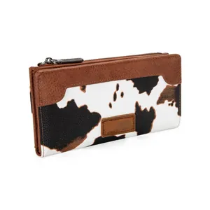 Fashionable women's long wallet featuring a cow print design and brown leather trim accents
