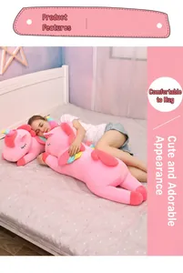Close-up of a large pink unicorn plush toy used as a comfortable body pillow