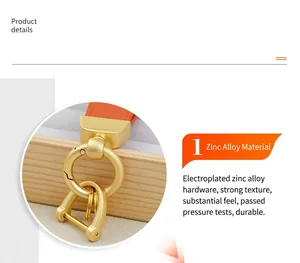 Close-up of high-quality golden zinc alloy hardware on orange leather keychain.