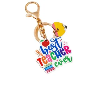 Colorful Best Teacher Ever keychain with apple and heart charms on white background