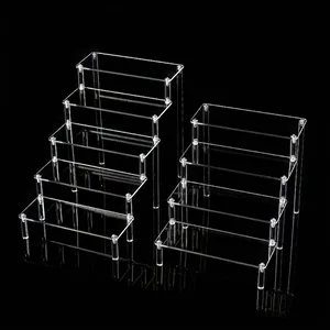 Clear acrylic tiered display stand for action figures, jewelry, and desk organization