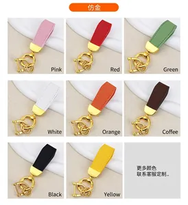 Eight colors of goat pattern leather keychains with gold-tone hardware buckles