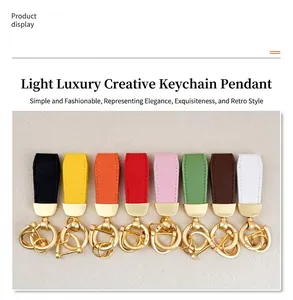 Collection of eight colorful goat pattern leather keychains with golden metal hardware