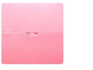 Detailed close-up showing the smooth hidden zipper on a pink plush unicorn doll toy