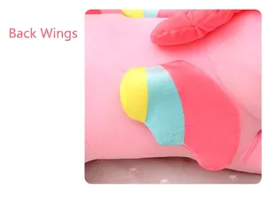 Detailed view of the colorful rainbow wing on a soft pink unicorn plush toy.