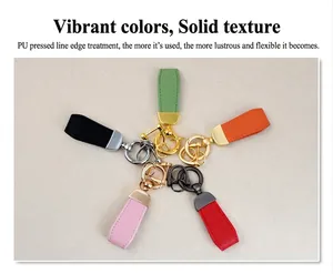 Multi-colored goat grain PU leather keychains with metallic rings on a neutral background.