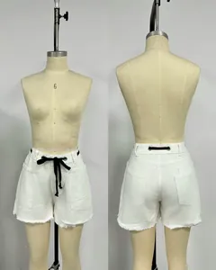 Front and back detail of white loose denim shorts with black drawstring and frayed hem