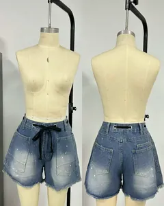 High-waisted loose denim shorts with black drawstring and pockets, front and back view