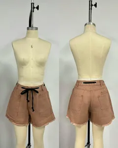 Front and back detail view of loose denim shorts with drawstring waist and frayed hem