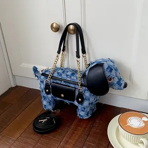 Unique dog-shaped denim shoulder bag featuring blue checkered fringe and leather accents.
