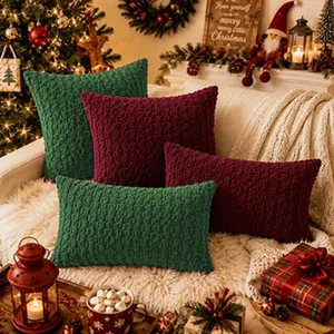 Close-up of textured green and burgundy Christmas decorative throw pillow covers