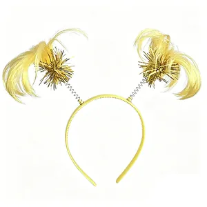 Detailed macro view of yellow feather headband with golden tinsel starburst and springs