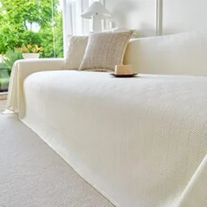 Close-up of the elegant weave texture on a cooling ice silk sofa cover in cream white color