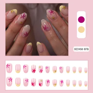 Elegant pink French press-on nails with yellow tips and magenta starfish charms