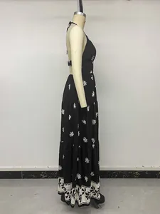 Side view of a vintage floral print halter maxi dress with backless design on a mannequin.