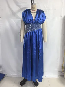 Elegant royal blue evening gown with shimmering sequined waist detail on a mannequin