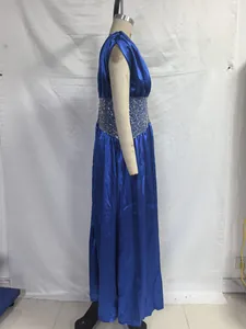 Side view of a royal blue satin sleeveless evening gown featuring a sequined waist band