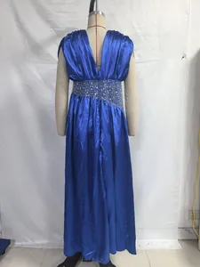 Back detail of royal blue satin evening gown featuring a beaded waistband on a mannequin