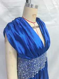 Detail view of blue satin evening gown with sequined waist and draped bodice