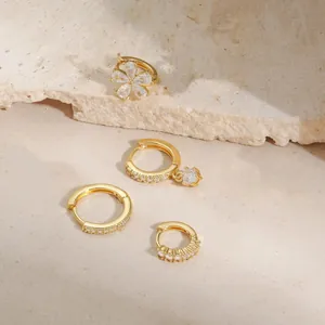 Elegant gold-plated jewelry set featuring zircon flower studs and classic hoop earrings
