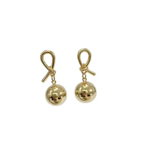 Elegant French vintage gold knot stud earrings with a polished spherical drop pendant