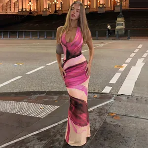 Elegant halter neck maxi dress featuring a vibrant abstract marble print design.