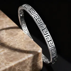 Vintage Greek key pattern stainless steel bangle with elegant silver finish for women