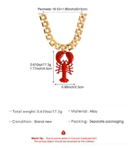 Gold link chain necklace with red lobster pendant and size dimensions