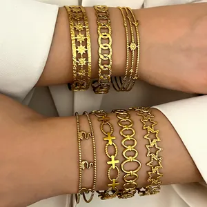 Exquisite close-up detail of stacked Bohemian vintage gold stainless steel bracelets for women