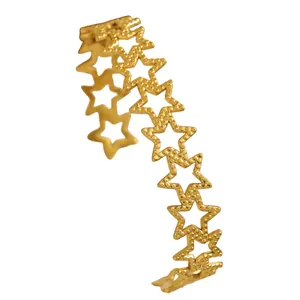 Close-up of gold-plated stainless steel star bracelet with granulated texture.