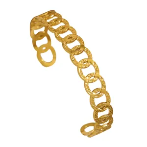 Detailed view of a vintage gold stainless steel open cuff bracelet with link design.