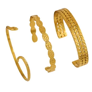 Detailed view showing three unique textures on vintage gold stainless steel cuff bracelets