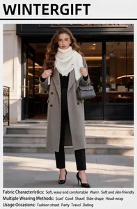 Elegant white hollow-out knitted shawl styled for autumn street fashion look