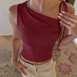 Close-up of wine red asymmetrical neck tank top with drawstring ruching detail.