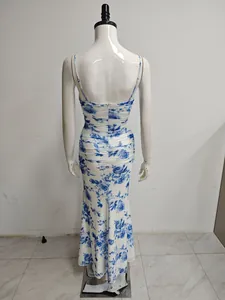 Back view of mesh spaghetti strap floral dress with ruched mermaid hem.