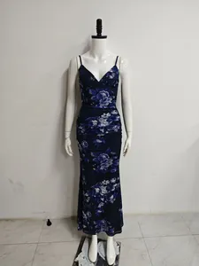 Detail of a floral print mesh cami dress with ruched waist and mermaid hemline.