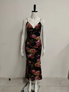 Detailed view of a black floral mesh maxi dress with ruching on a white mannequin