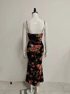 Detailed back view of sexy floral print ruched mesh maxi mermaid dress on mannequin